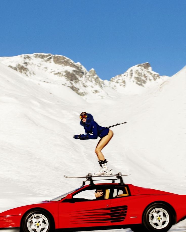 Girl skiing on red car